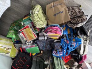 collection of school supplies in bags