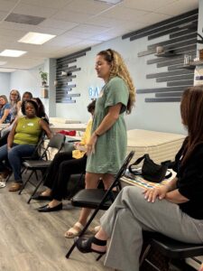 female standing near a bed