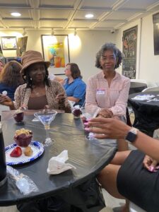 2 women sitting around a table