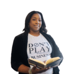 female holding open book