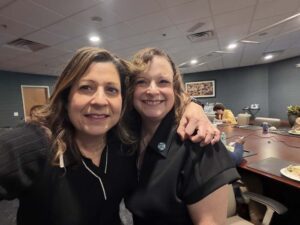 2 females smiling