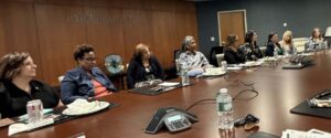 women sitting around conference table